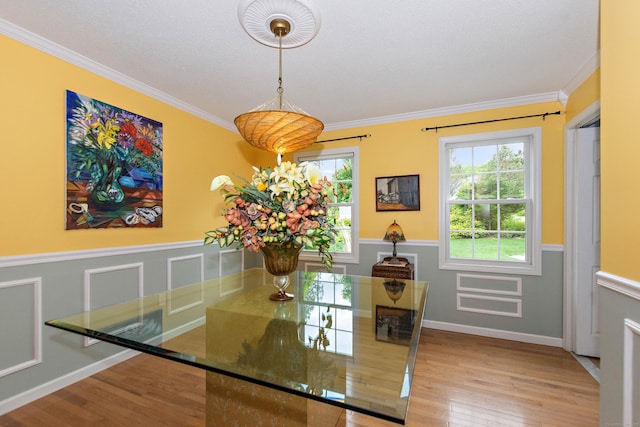 273 New London Rd, Colchester, CT 06415 - dining area featuring wood finished floors, a wainscoted wall, and crown molding