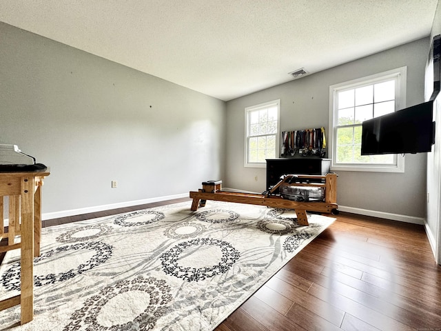 273 New London Rd, Colchester, CT 06415 - living area featuring wood finished floors, a textured ceiling, and baseboards