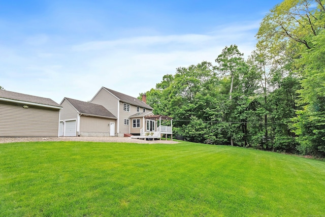 273 New London Rd, Colchester, CT 06415 - view of green lawn featuring an attached garage and a wooden deck