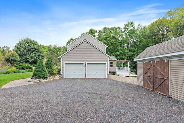 273 New London Rd, Colchester, CT 06415 - detached garage featuring view of wooded area