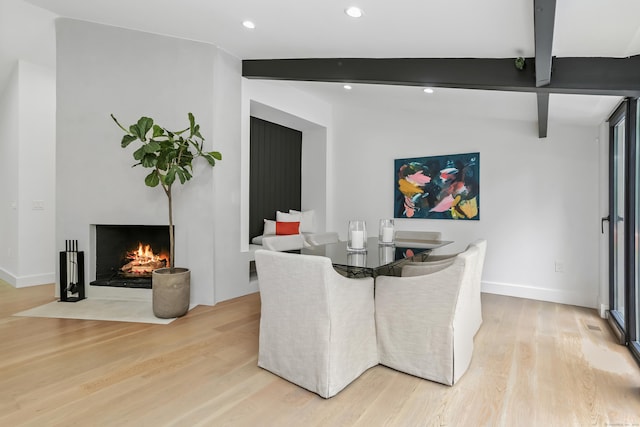 23 Wyndover Ln N, Stamford, CT 06902 - dining room featuring light wood finished floors, beam ceiling, recessed lighting, a fireplace with flush hearth, and baseboards