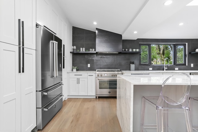 23 Wyndover Ln N, Stamford, CT 06902 - kitchen featuring premium appliances, open shelves, wall chimney exhaust hood, and recessed lighting