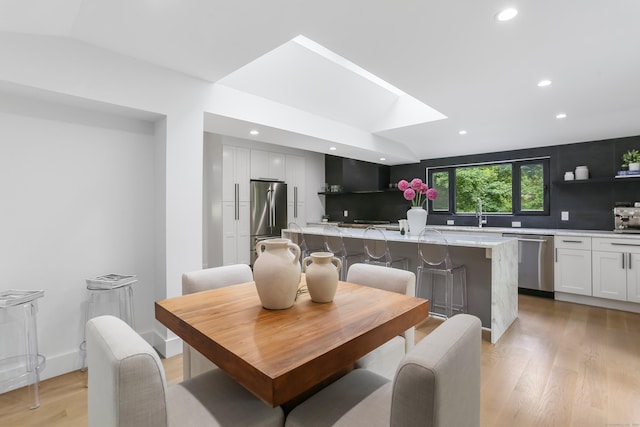 23 Wyndover Ln N, Stamford, CT 06902 - dining area with light wood-style floors, recessed lighting, and lofted ceiling