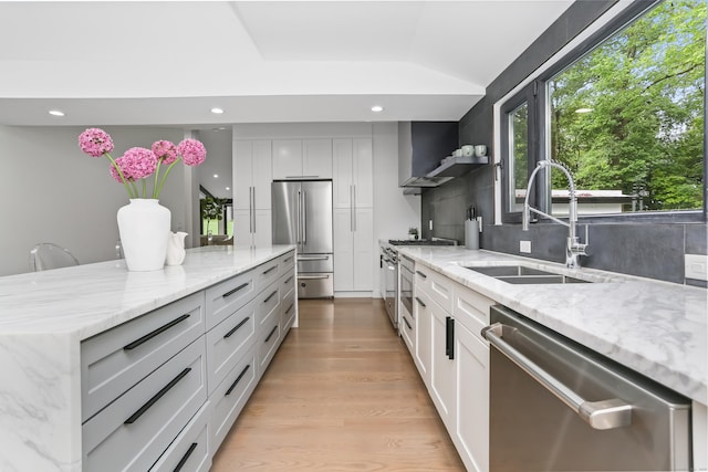 23 Wyndover Ln N, Stamford, CT 06902 - kitchen featuring high quality appliances, a sink, recessed lighting, backsplash, and light stone counters