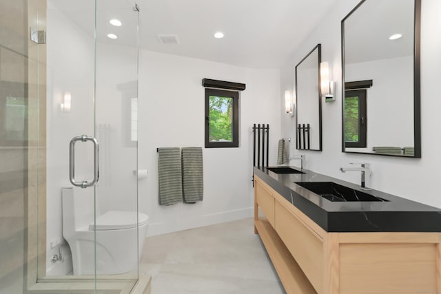 23 Wyndover Ln N, Stamford, CT 06902 - full bath featuring double vanity, a shower stall, recessed lighting, toilet, and baseboards