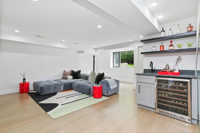 23 Wyndover Ln N, Stamford, CT 06902 - living area with wine cooler, wet bar, light wood-type flooring, recessed lighting, and baseboards