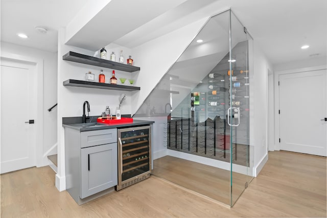 23 Wyndover Ln N, Stamford, CT 06902 - indoor wet bar featuring wine cooler, light wood-style flooring, recessed lighting, and baseboards