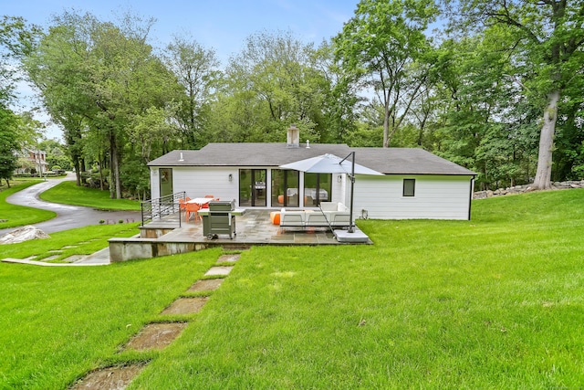 23 Wyndover Ln N, Stamford, CT 06902 - back of property featuring a yard, a chimney, and outdoor lounge area