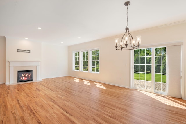51 Lexington Gdns Unit 51, North Haven, CT 06473 - unfurnished living room featuring a chandelier, light wood-type flooring, baseboards, a fireplace with flush hearth, and ornamental molding