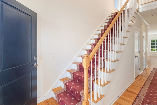 51 Lexington Gdns Unit 51, North Haven, CT 06473 - stairway with wood finished floors, baseboards, and ornamental molding