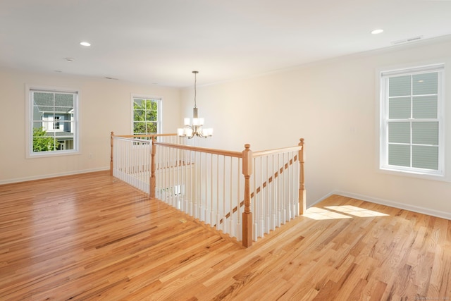 51 Lexington Gdns Unit 51, North Haven, CT 06473 - staircase with a chandelier, wood finished floors, baseboards, and recessed lighting
