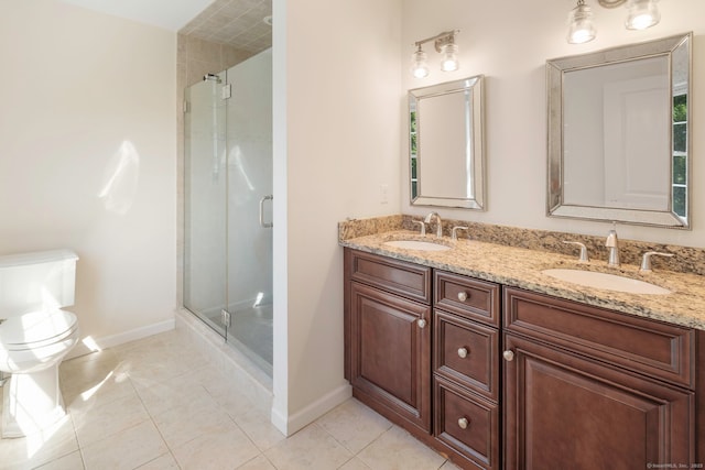 51 Lexington Gdns Unit 51, North Haven, CT 06473 - bathroom featuring baseboards, a shower stall, double vanity, and toilet