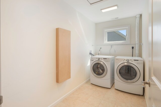 51 Lexington Gdns Unit 51, North Haven, CT 06473 - laundry area featuring washing machine and dryer, light tile patterned flooring, and baseboards