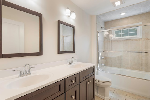 51 Lexington Gdns Unit 51, North Haven, CT 06473 - bathroom with toilet, double vanity, combined bath / shower with glass door, and tile patterned floors