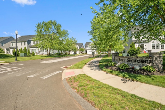 51 Lexington Gdns Unit 51, North Haven, CT 06473 - view of asphalt street featuring sidewalks, a residential view, street lights, and curbs