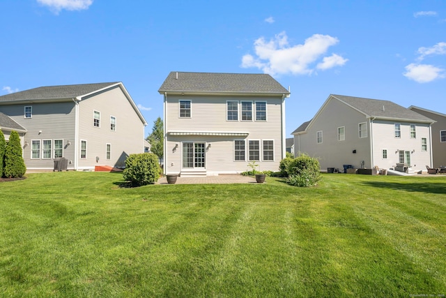 51 Lexington Gdns Unit 51, North Haven, CT 06473 - rear view of house featuring a patio area and a lawn