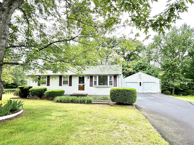107 Montemerlo Ave, Windsor Locks, CT 06096 - view of front of property with an outdoor structure, a detached garage, and a front lawn