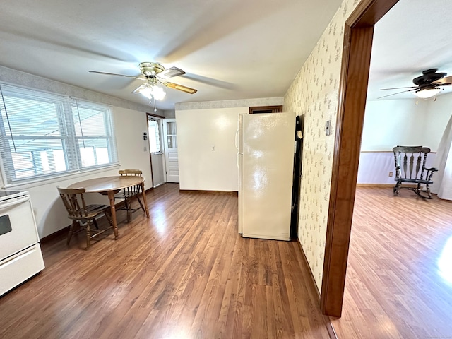 107 Montemerlo Ave, Windsor Locks, CT 06096 - dining space featuring ceiling fan, wallpapered walls, wood finished floors, and baseboards