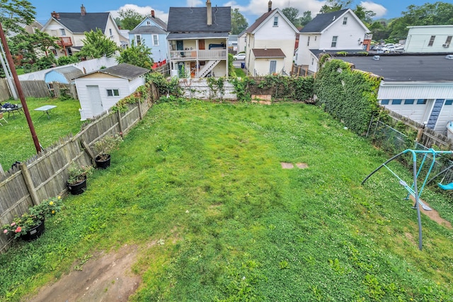 67 Ash St, Bridgeport, CT 06605 - fenced backyard with a residential view and an outdoor structure