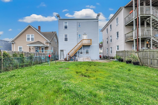 67 Ash St, Bridgeport, CT 06605 - back of house with stairway and a fenced backyard