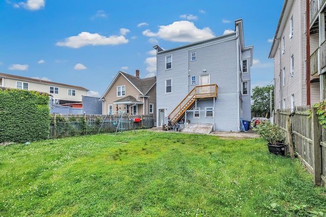 67 Ash St, Bridgeport, CT 06605 - rear view of house featuring a fenced backyard