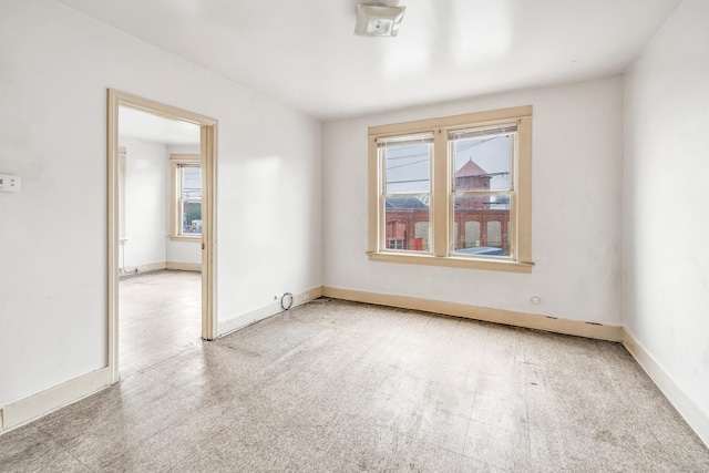 67 Ash St, Bridgeport, CT 06605 - empty room with tile patterned floors and baseboards
