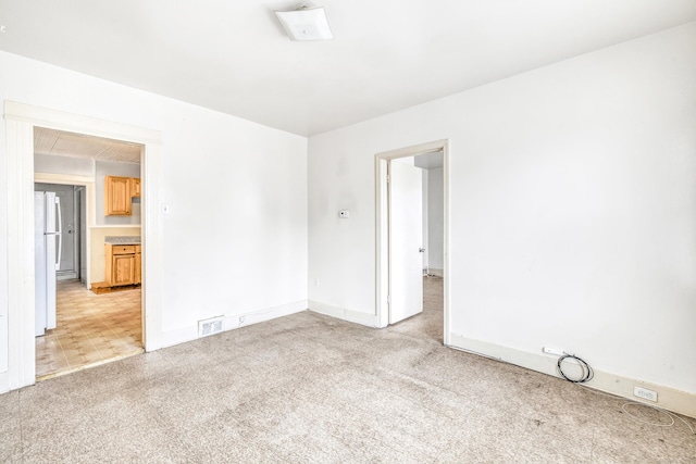 67 Ash St, Bridgeport, CT 06605 - empty room with light carpet and baseboards