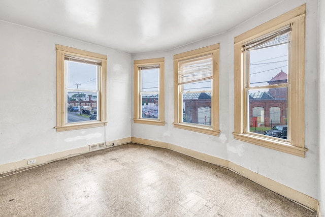 67 Ash St, Bridgeport, CT 06605 - empty room featuring baseboards and tile patterned floors