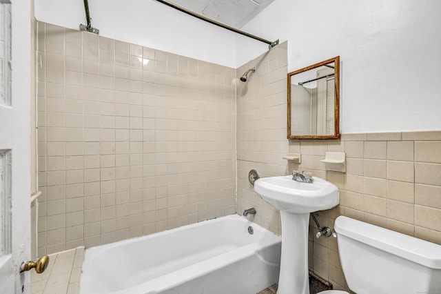 67 Ash St, Bridgeport, CT 06605 - full bath featuring  shower combination, tile walls, and wainscoting
