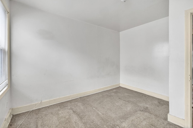 67 Ash St, Bridgeport, CT 06605 - carpeted empty room featuring baseboards