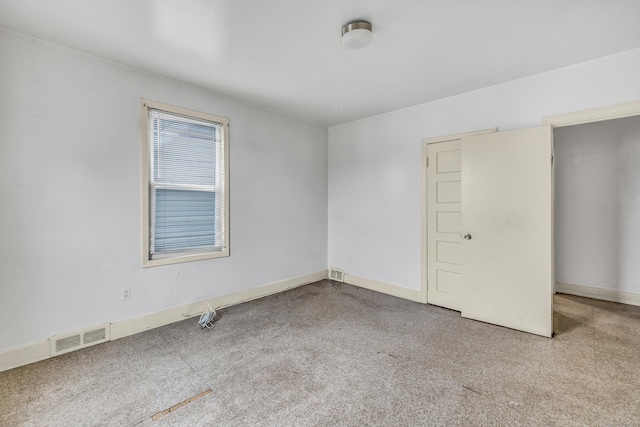 67 Ash St, Bridgeport, CT 06605 - unfurnished bedroom featuring baseboards