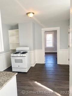 67 Ash St, Bridgeport, CT 06605 - kitchen with white range with gas cooktop, dark wood-style floors, wainscoting, open shelves, and white cabinetry