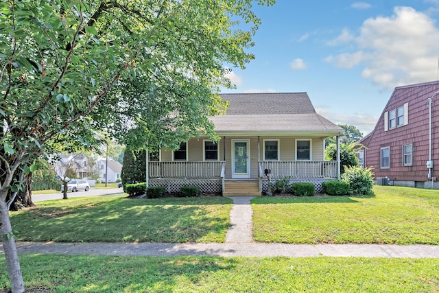 855 Stratford Rd, Stratford, CT 06615 - bungalow-style house with a porch, a front lawn, and roof with shingles