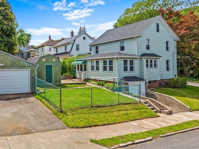 102 Columbus Ave, Meriden, CT 06451 - view of front of home with asphalt driveway and roof with shingles