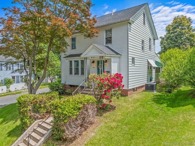 102 Columbus Ave, Meriden, CT 06451 - view of front facade featuring cooling unit, a front yard, and roof with shingles