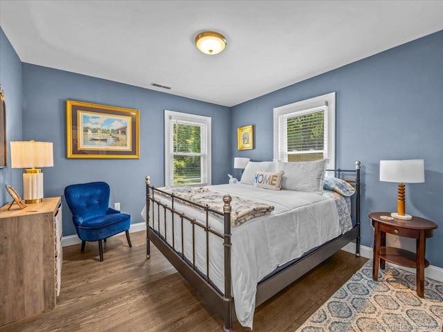 102 Columbus Ave, Meriden, CT 06451 - bedroom with multiple windows, wood finished floors, and baseboards