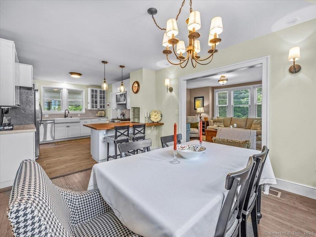 102 Columbus Ave, Meriden, CT 06451 - dining area with a chandelier and light wood finished floors