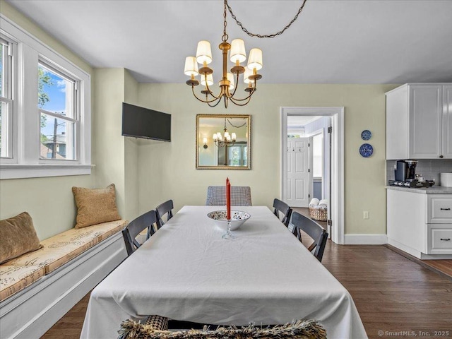 102 Columbus Ave, Meriden, CT 06451 - dining space with a chandelier, dark wood-style flooring, and baseboards