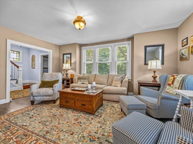 102 Columbus Ave, Meriden, CT 06451 - living area featuring plenty of natural light, stairs, wood finished floors, and baseboards