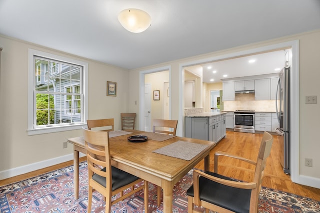 89 Pease Rd, Woodbridge, CT 06525 - dining area with light wood-style flooring, baseboards, and recessed lighting