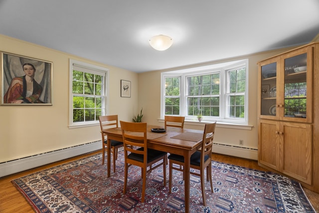 89 Pease Rd, Woodbridge, CT 06525 - dining room with a baseboard heating unit and wood finished floors