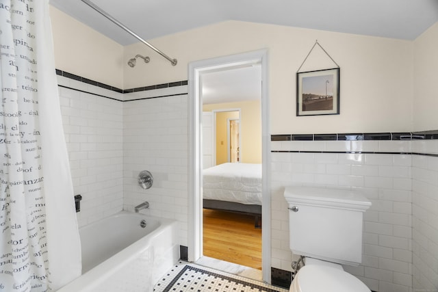 89 Pease Rd, Woodbridge, CT 06525 - full bath featuring shower / bath combo, toilet, ensuite bath, tile walls, and tile patterned floors