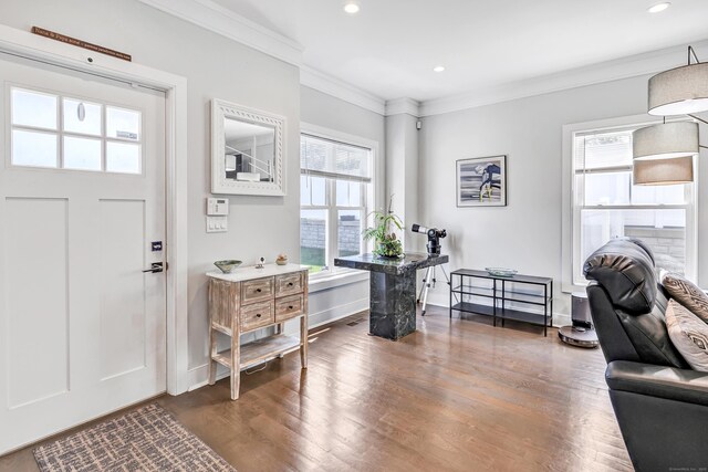 74 Sterling St, Fairfield, CT 06825 - entrance foyer with dark wood-type flooring, crown molding, recessed lighting, and baseboards