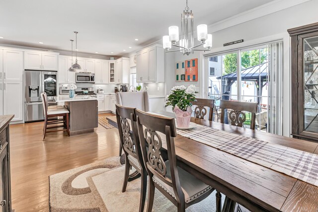 74 Sterling St, Fairfield, CT 06825 - dining room featuring a chandelier, light wood-style floors, and recessed lighting