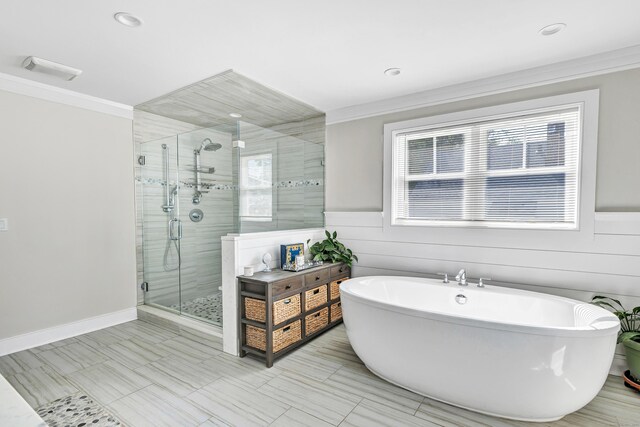 74 Sterling St, Fairfield, CT 06825 - full bathroom with a freestanding tub, a stall shower, ornamental molding, a wainscoted wall, and recessed lighting