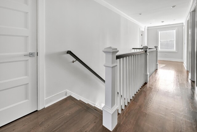 74 Sterling St, Fairfield, CT 06825 - stairs with wood finished floors, crown molding, and baseboards