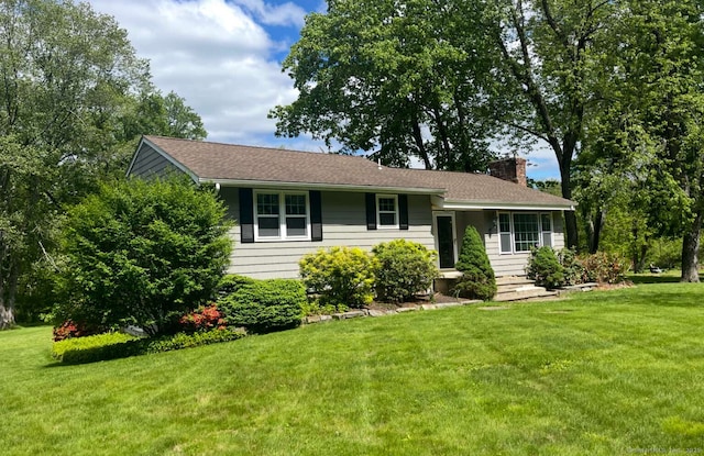 18 Great Meadow Rd, Redding, CT 06896 - view of front of house with a chimney and a front lawn