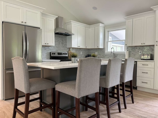 18 Great Meadow Rd, Redding, CT 06896 - kitchen with stainless steel appliances, wall chimney range hood, lofted ceiling, backsplash, and a center island
