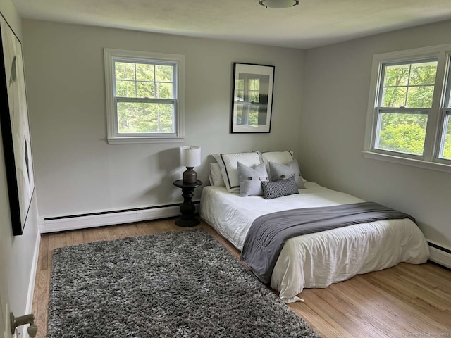 18 Great Meadow Rd, Redding, CT 06896 - bedroom featuring baseboard heating, multiple windows, and wood finished floors
