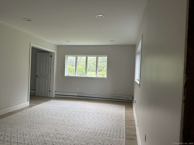 18 Great Meadow Rd, Redding, CT 06896 - unfurnished room with baseboard heating, light wood-style floors, recessed lighting, and baseboards